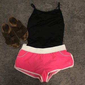 OP neon pink and white swim shorts.